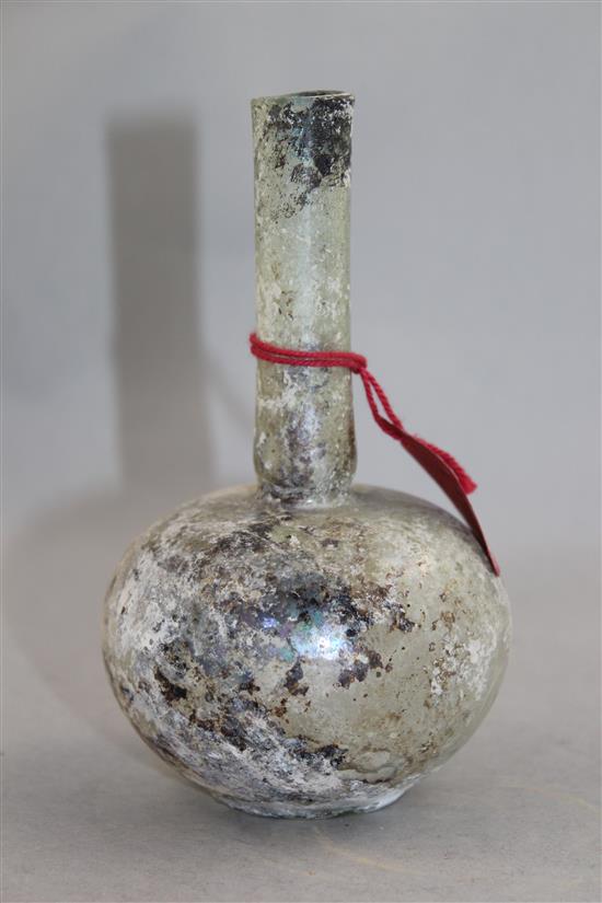 A Roman clear glass flask, c.1st / 2nd century AD, 14.5cm